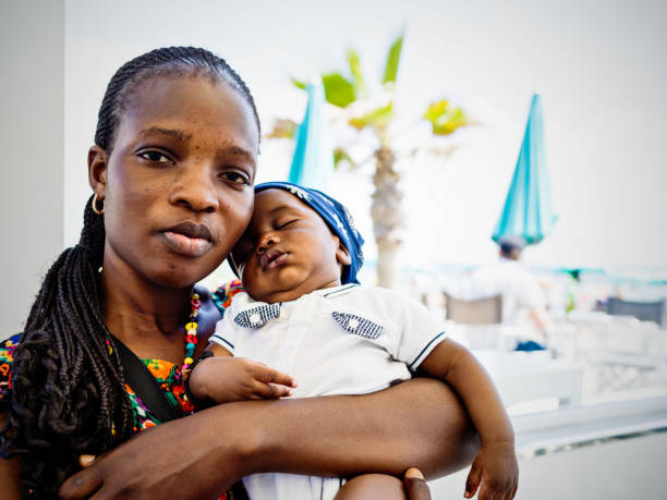 Young African emigrant mother with baby